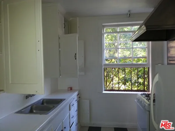a view of a sink and a window