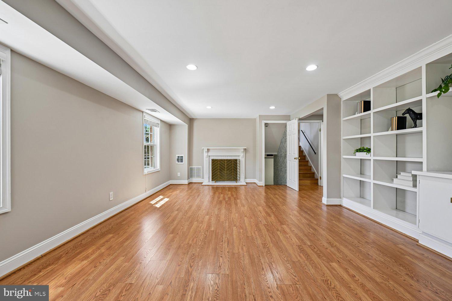 10706 Stoneyhill Drive Silver Spring, MD 20901 - Photo 16 of 49 Lower level living area w/ wood burning fireplace
