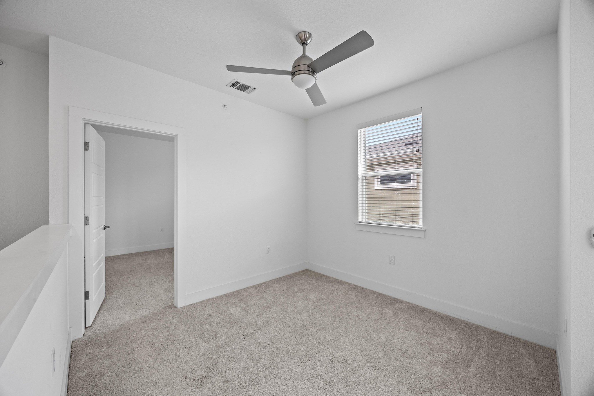 2222 Simond Avenue, Unit E Austin, TX 78723 - Photo 17 of 28 Upstairs has a bonus room between the two secondary bedrooms.