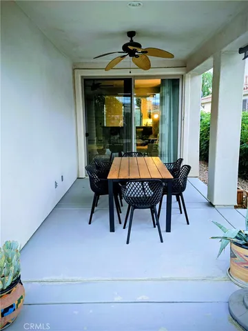 a view of dining table chairs and chandelier