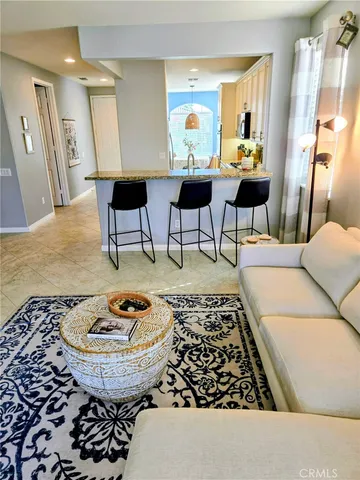 a kitchen with granite countertop white cabinets stainless steel appliances and sink