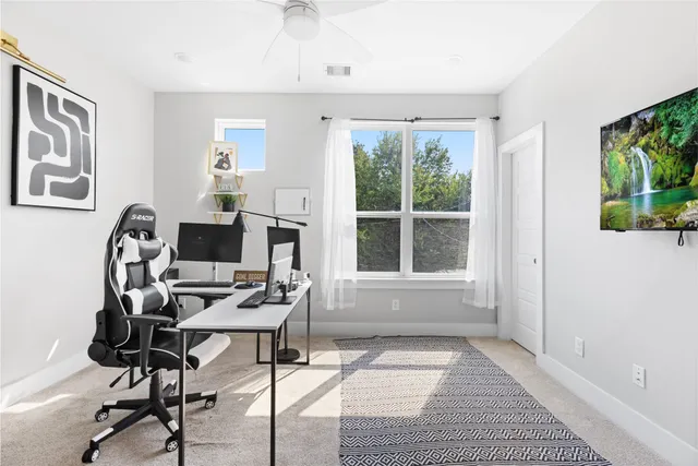 a workspace with furniture and a window