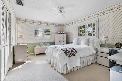 a bedroom with a bed and a couch