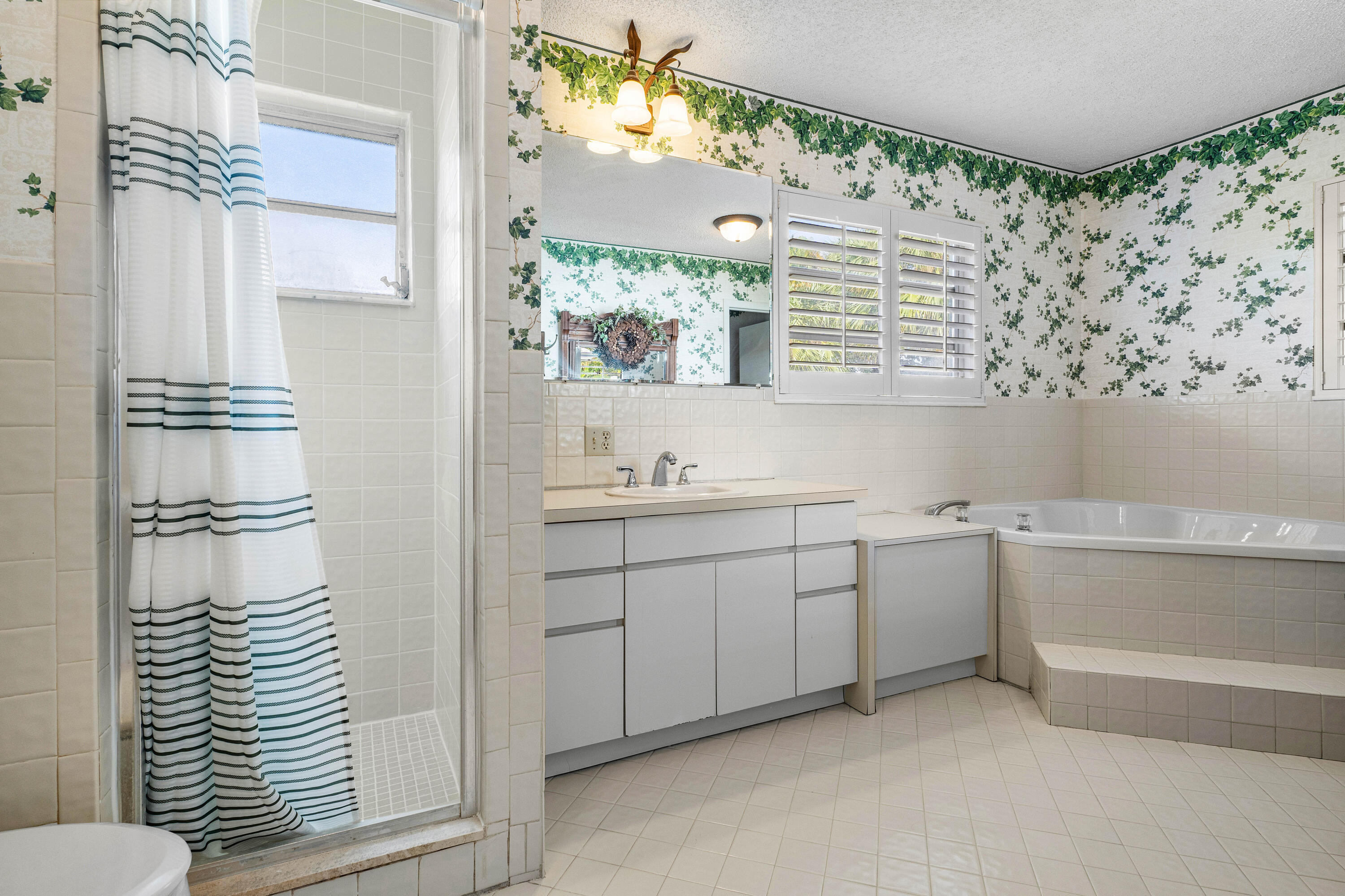 1210 Dolphin Road Singer Island, FL 33404 - Photo 25 of 41 a bathroom with a sink and a mirror