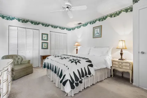 a bedroom with a bed bed and a chandelier