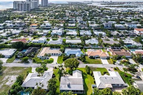 an aerial view of residential houses with outdoor space