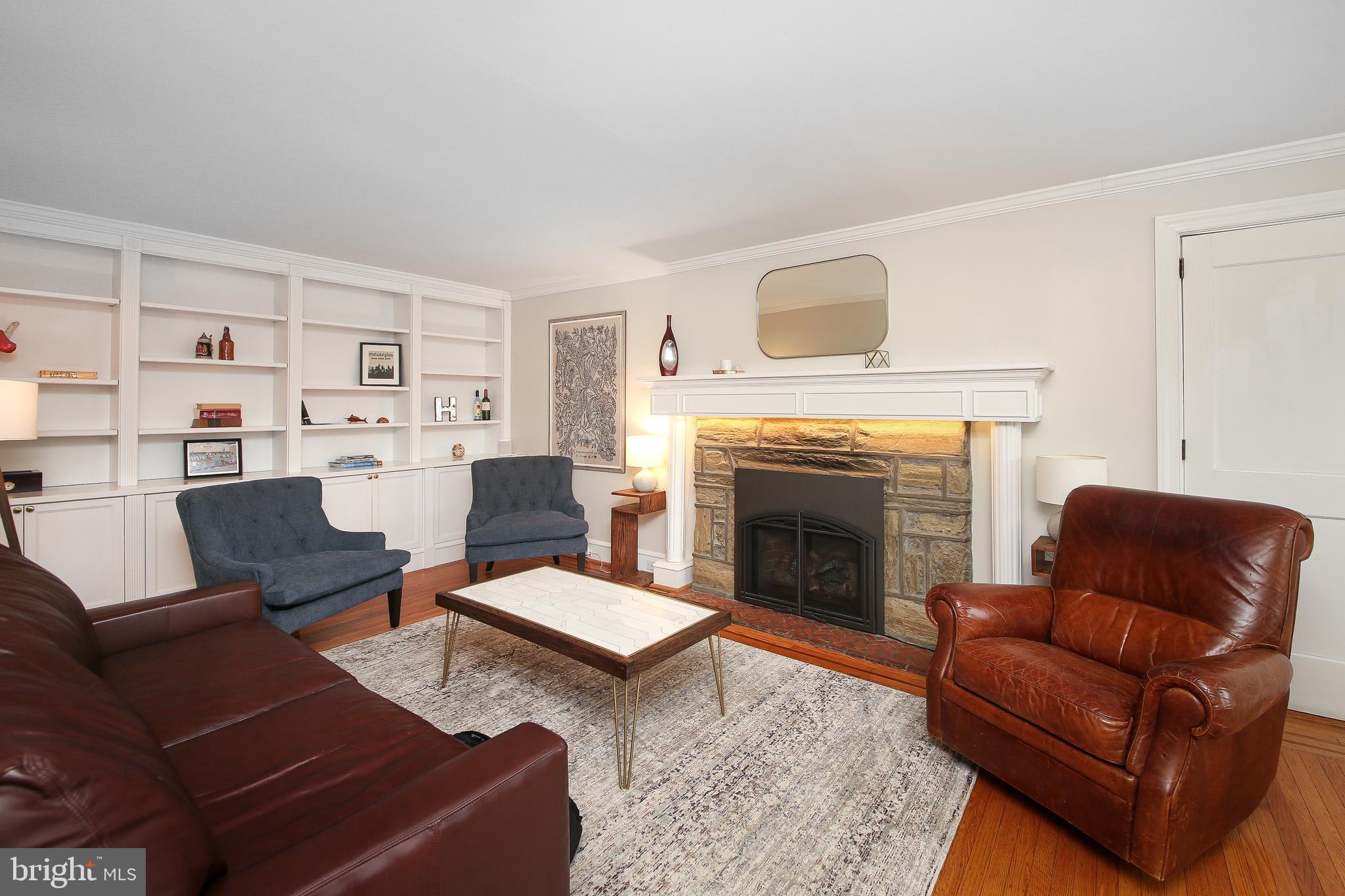 20 Hillside Road Wayne, PA 19087 - Photo 6 of 49 Formal living room features a stone gas fireplace