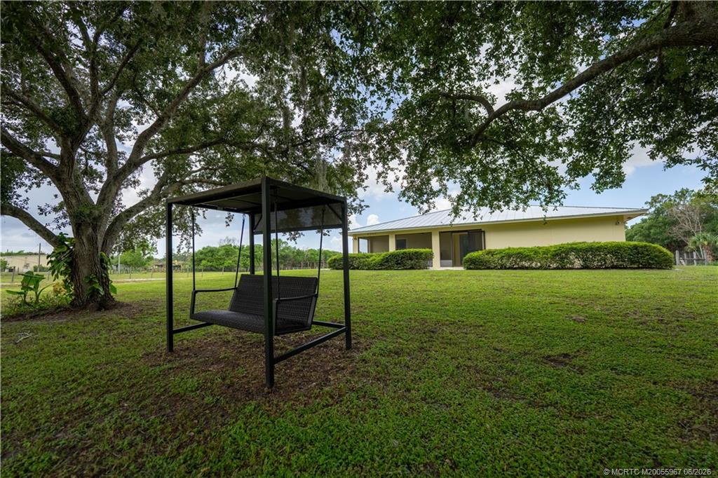 8200 Southwest Springhaven Avenue Indiantown, FL 34956 - Photo 28 of 35 a view of a house with a yard
