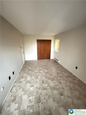 a view of an empty room and window