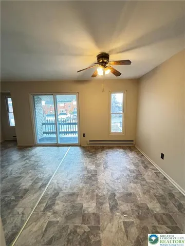 a view of an empty room with a window