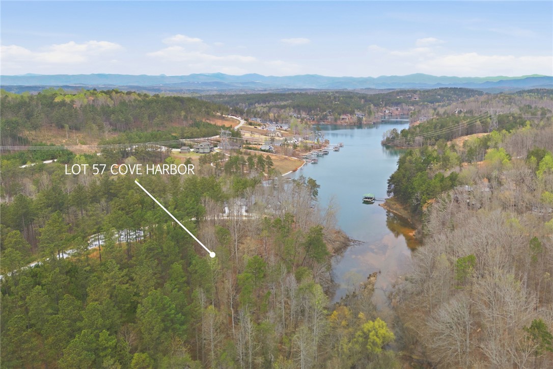 154 Bailey Street Six Mile, SC 29682 - Photo 20 of 22 This scenic waterfront lot offers tranquil lake views amidst lush woodlands and distant mountains.
