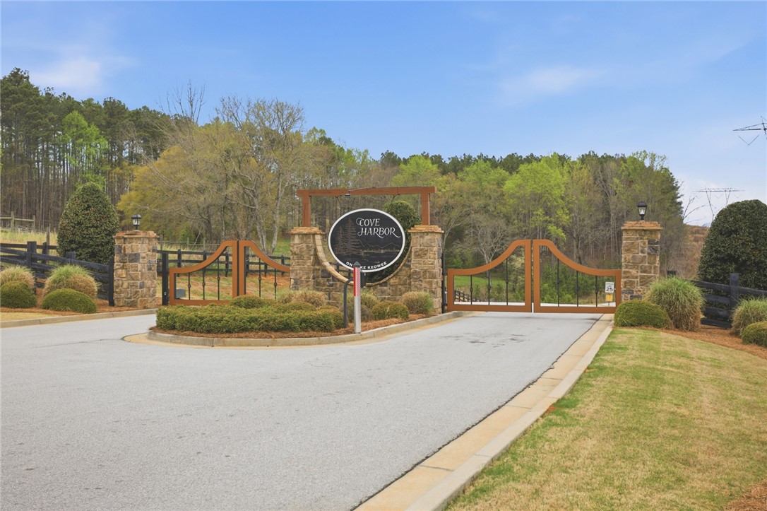 154 Bailey Street Six Mile, SC 29682 - Photo 9 of 22 Welcome home to this inviting gated community entrance, offering both security and natural serenity.