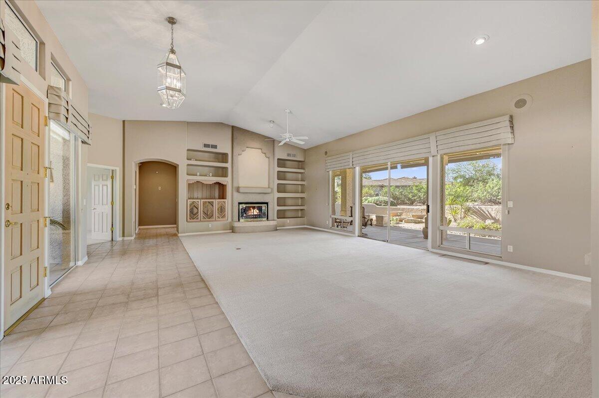 27002 North Agua Verde Drive Rio Verde, AZ 85263 - Photo 12 of 28 a view of a livingroom with furniture and a large window