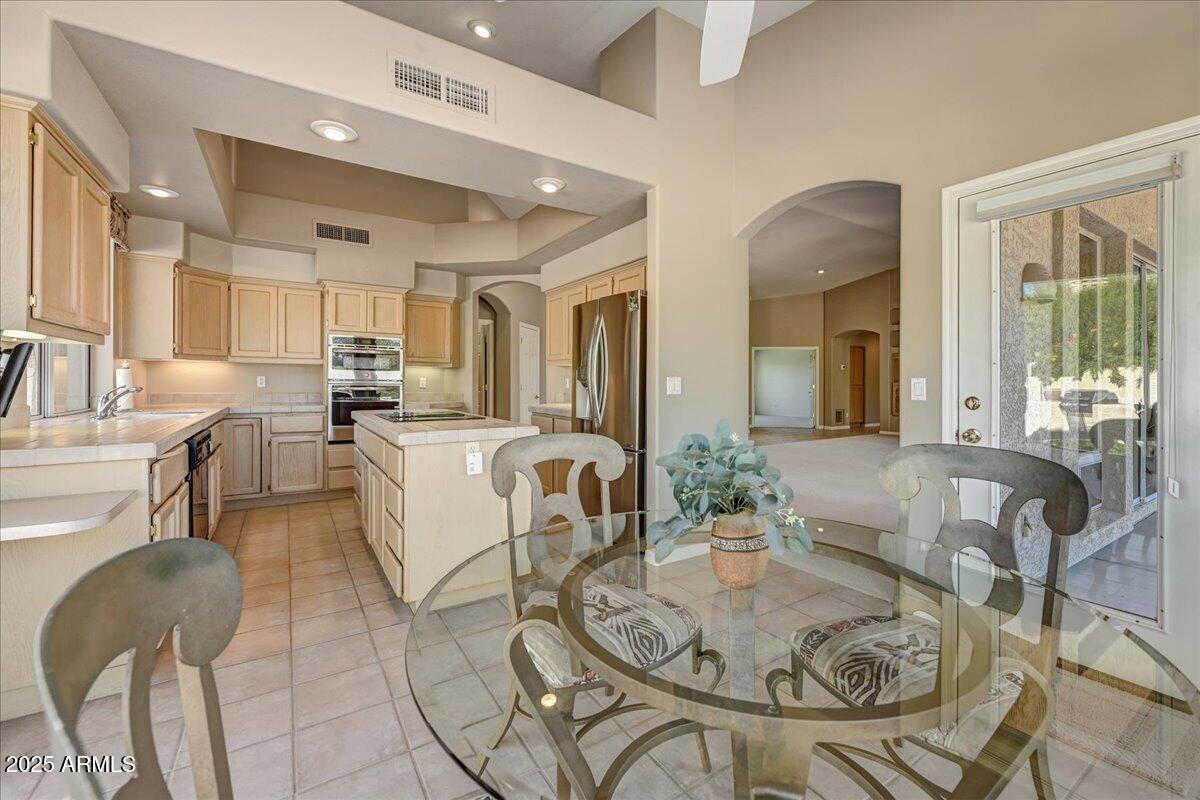 27002 North Agua Verde Drive Rio Verde, AZ 85263 - Photo 13 of 28 a living room with furniture and a table