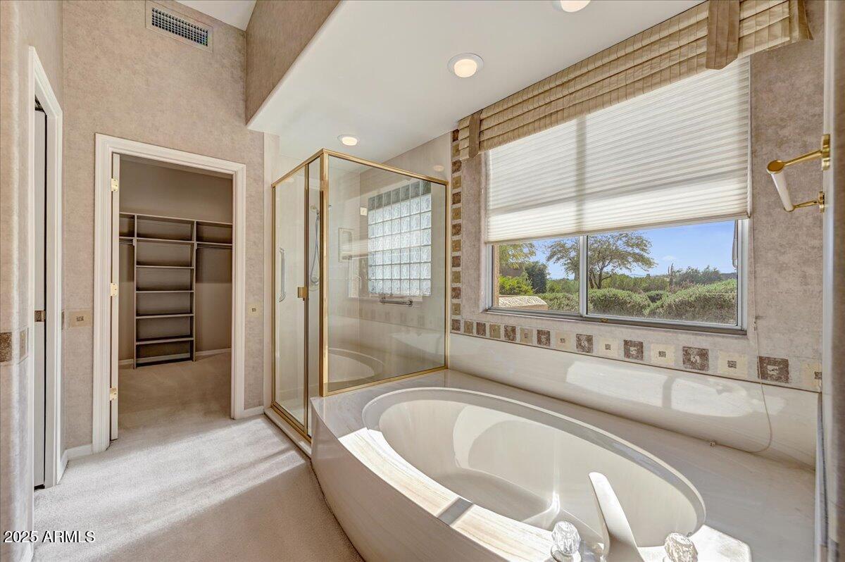 27002 North Agua Verde Drive Rio Verde, AZ 85263 - Photo 19 of 28 a spacious bathroom with a tub and a large window