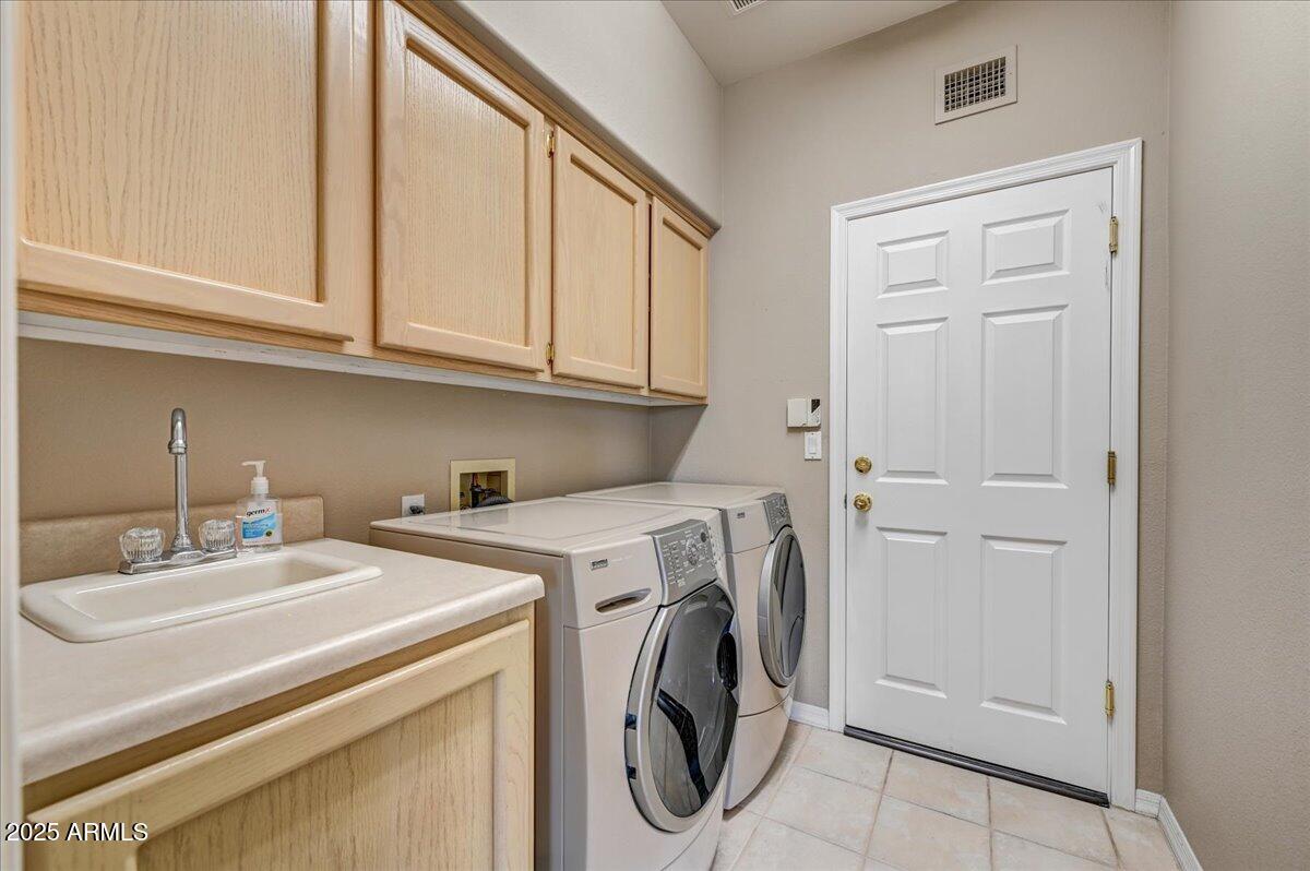 27002 North Agua Verde Drive Rio Verde, AZ 85263 - Photo 24 of 28 a utility room with dryer and washer