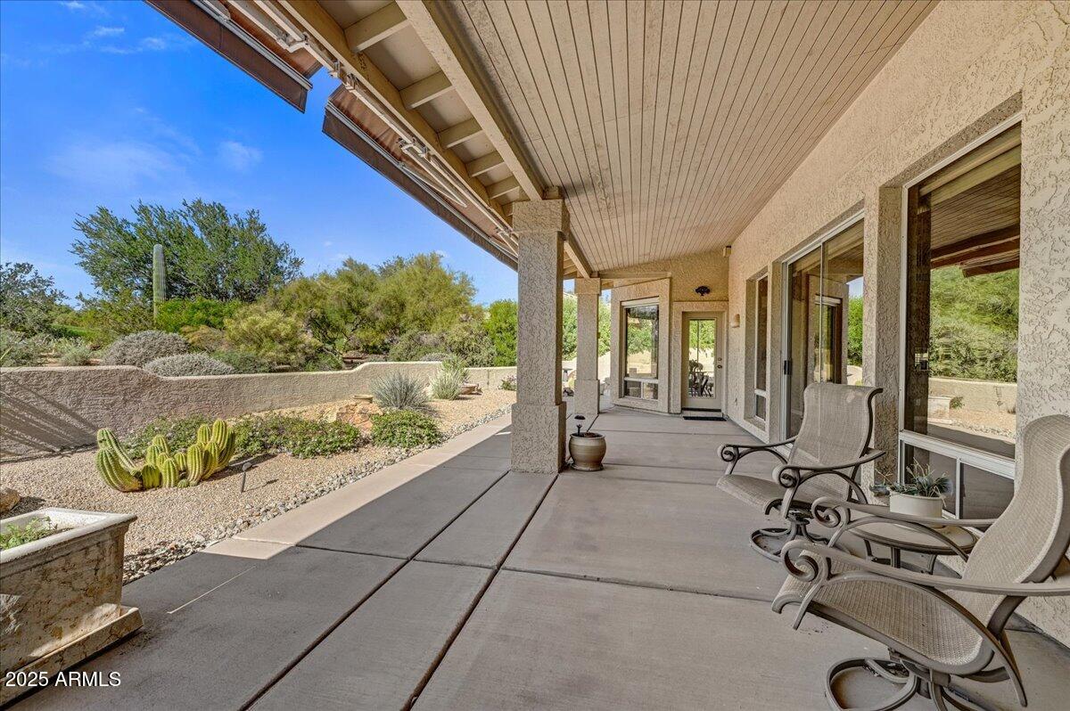27002 North Agua Verde Drive Rio Verde, AZ 85263 - Photo 25 of 28 a view of a chairs and table in the balcony
