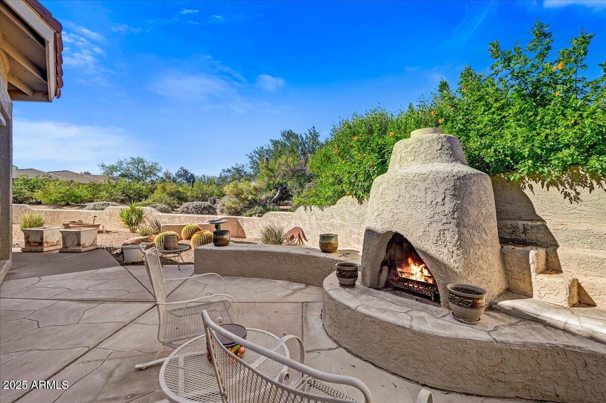 27002 North Agua Verde Drive Rio Verde, AZ 85263 - Photo 28 of 28 a terrace of a house with outdoor seating