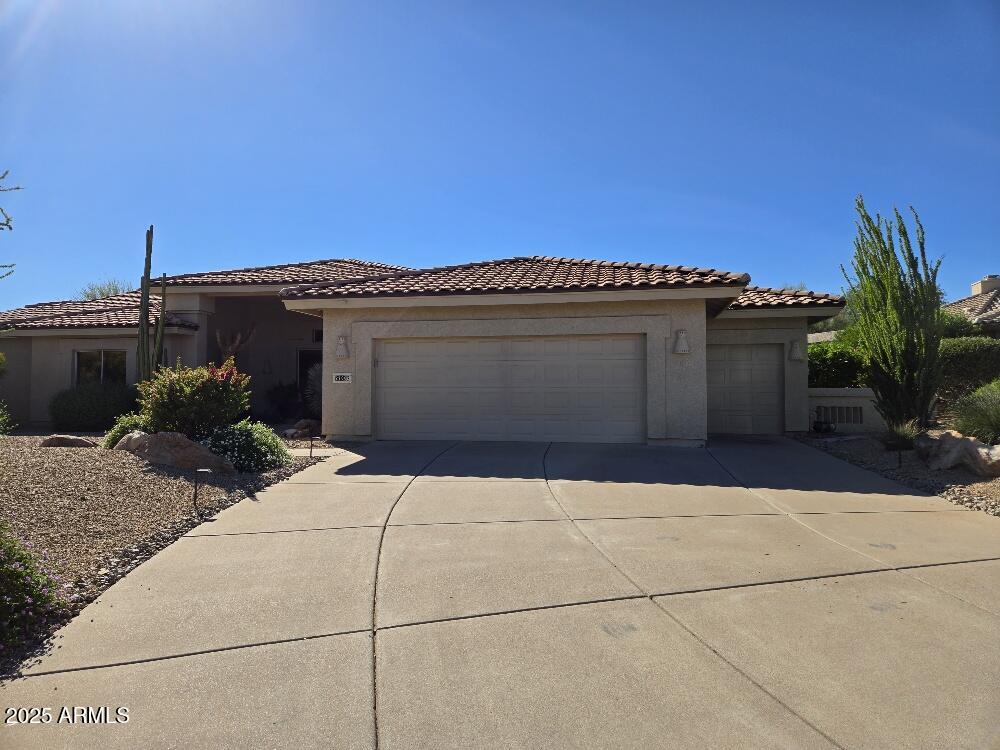 27002 North Agua Verde Drive Rio Verde, AZ 85263 - Photo 6 of 28 a front view of a house with a garage