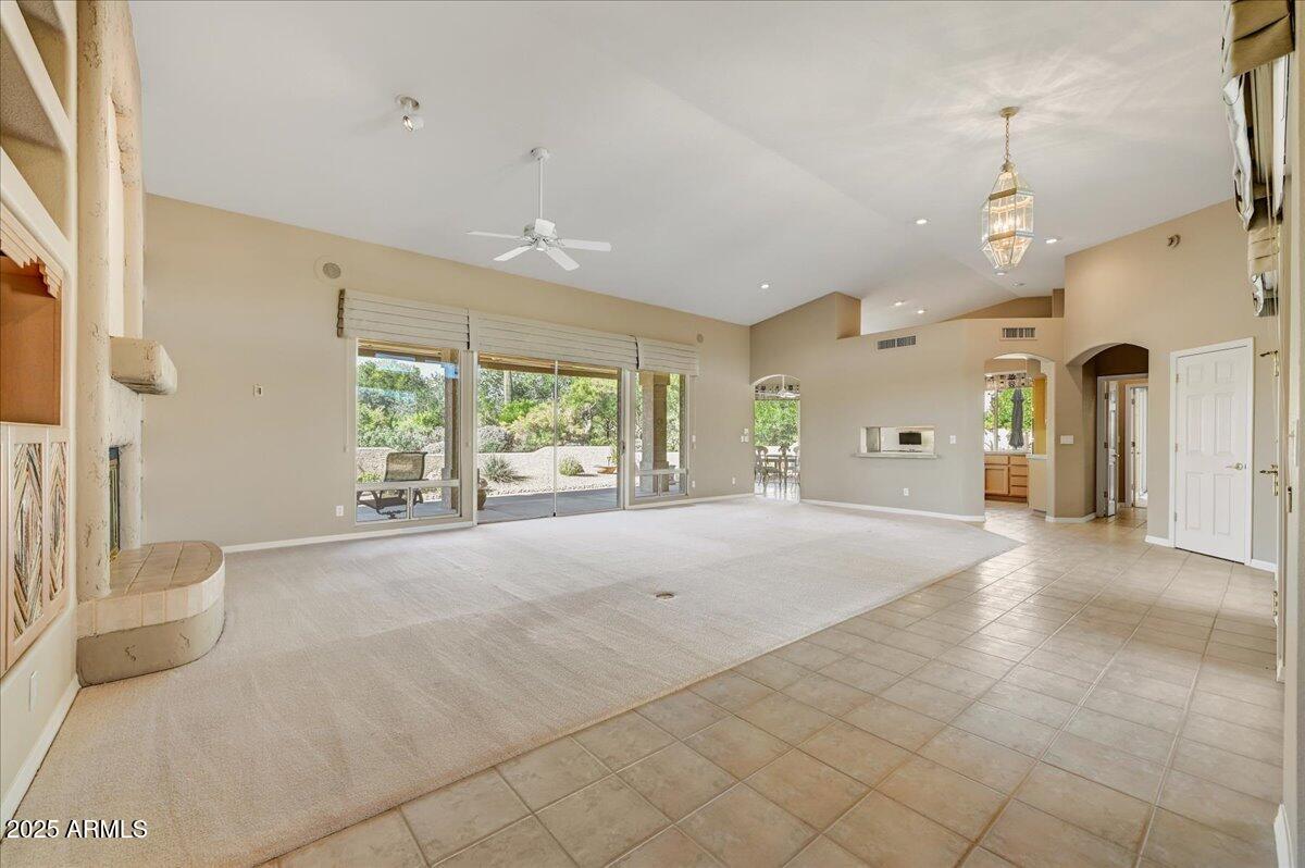 27002 North Agua Verde Drive Rio Verde, AZ 85263 - Photo 9 of 28 a spacious bathroom with a granite countertop sink a large mirror and a shower