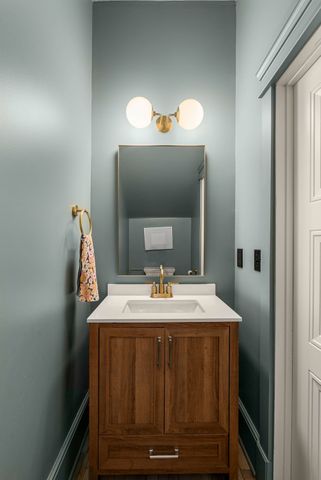 a view of a kitchen with kitchen island a sink stainless steel appliances counter space and a window