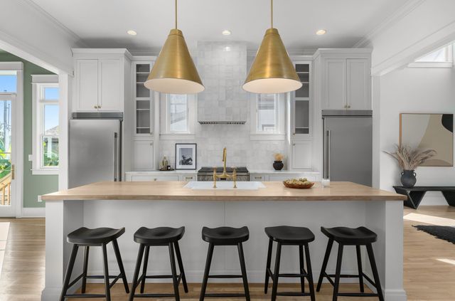 a table with a painting on wall and a potted plant