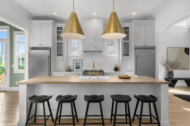 a table with a painting on wall and a potted plant