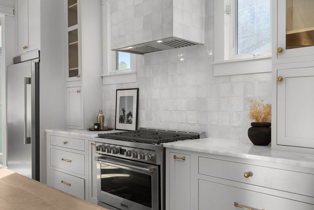 a view of a hallway with closet and wooden floor