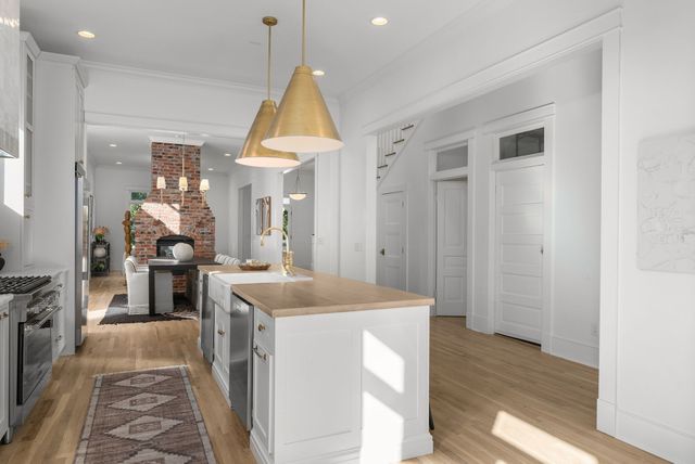 a living room with furniture and large windows