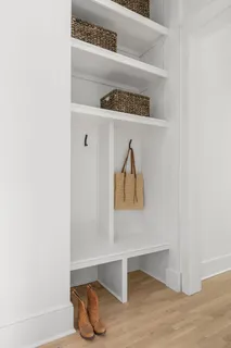 a bedroom with a bed and a couch next to a window