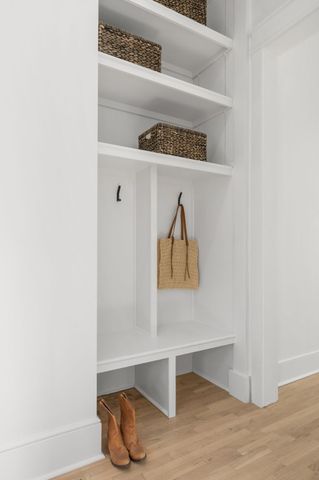 a bedroom with a bed and a couch next to a window