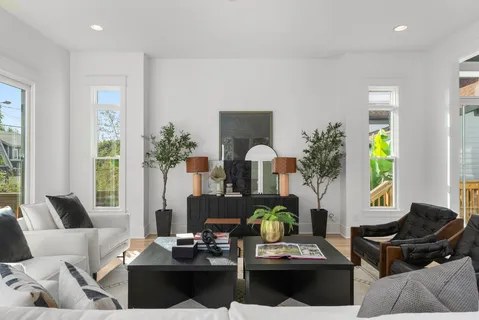 a bathroom with a granite countertop sink a toilet and shower