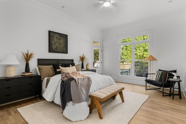 a view of hallway with furniture and a window