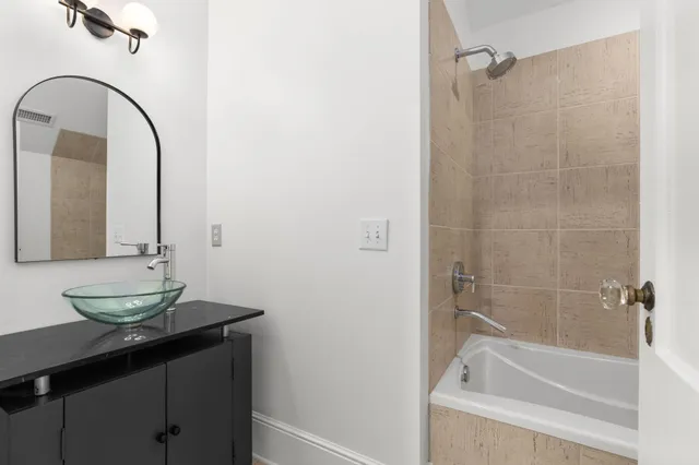 a bedroom with furniture and a chandelier