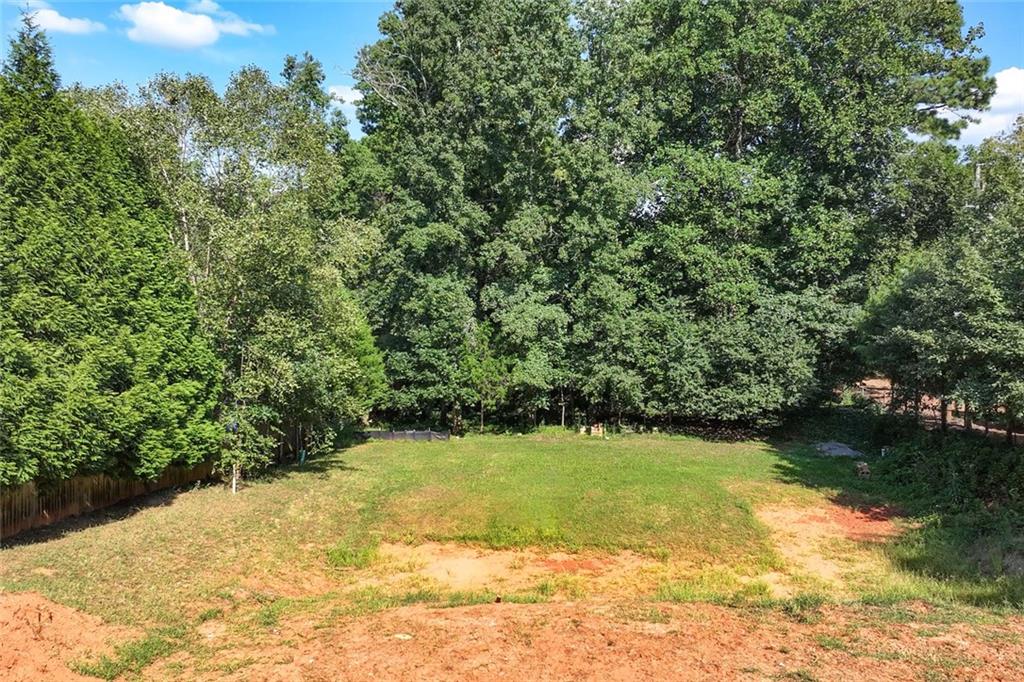 383 Westside Drive Roswell, GA 30075 - Photo 2 of 28 a view of a garden with a chair