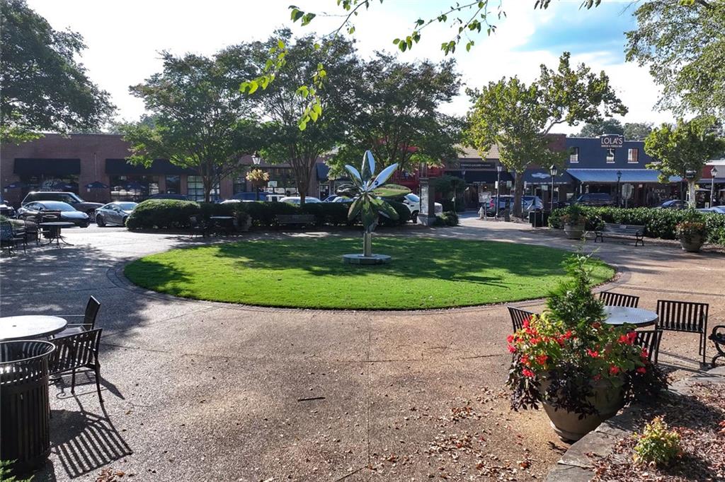 383 Westside Drive Roswell, GA 30075 - Photo 21 of 28 a front view of a house with a garden and patio