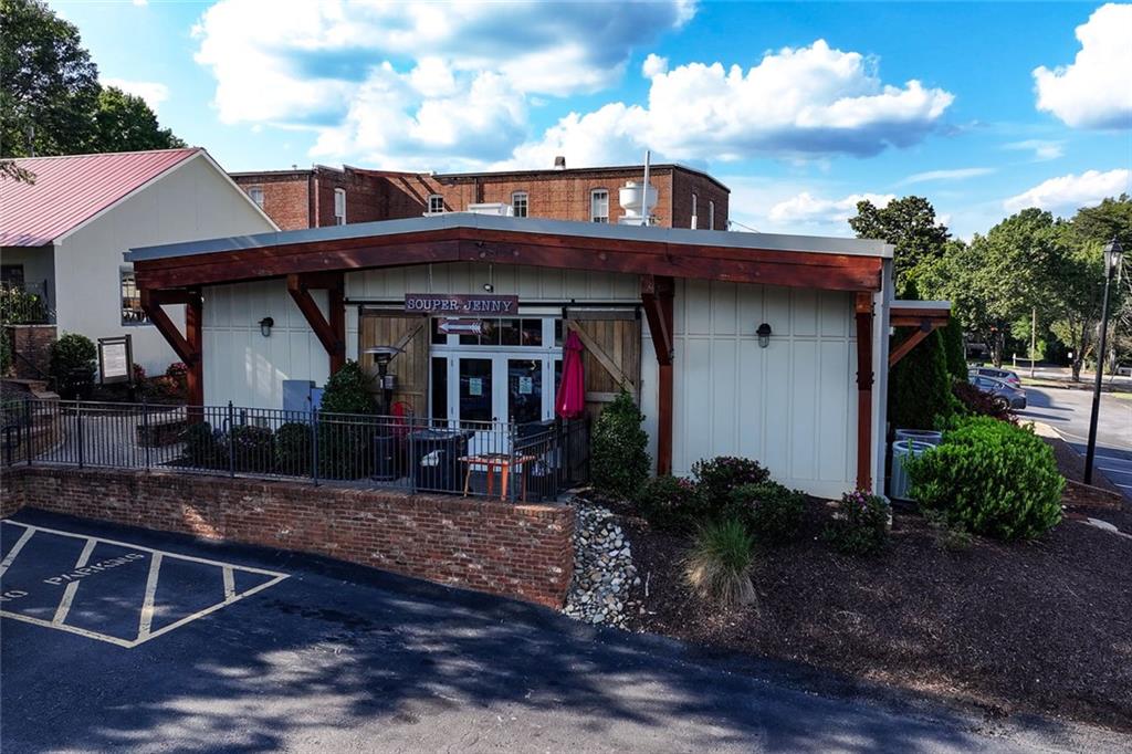 383 Westside Drive Roswell, GA 30075 - Photo 22 of 28 a front view of a house with garden