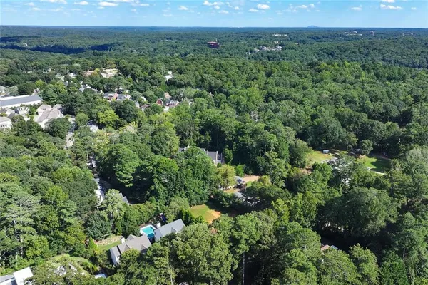 an aerial view of a houses with a yard