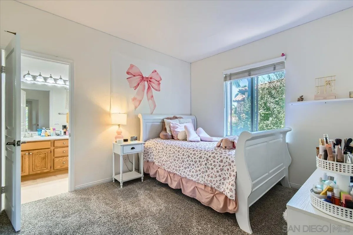 1382 Sparrow Road Carlsbad, CA 92011 - Photo 16 of 34 a bedroom with a bed and a couch