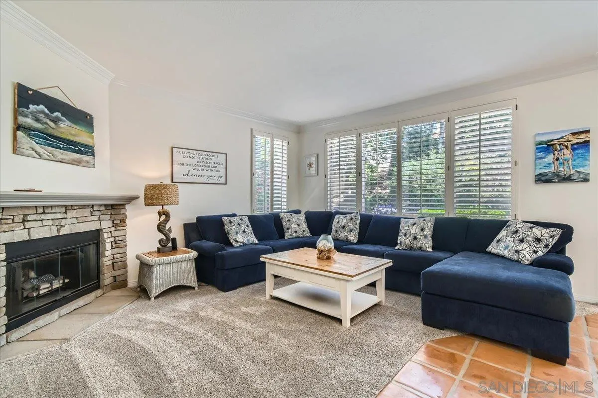 1382 Sparrow Road Carlsbad, CA 92011 - Photo 18 of 34 a living room with furniture and a fireplace