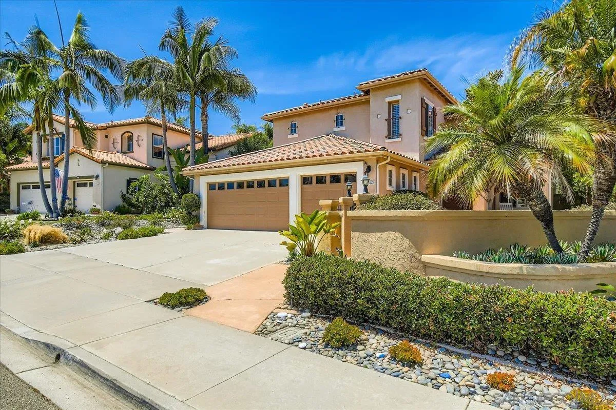 1382 Sparrow Road Carlsbad, CA 92011 - Photo 2 of 34 a front view of a house with a garden