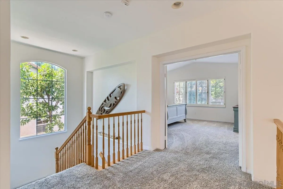 1382 Sparrow Road Carlsbad, CA 92011 - Photo 22 of 34 a view of a hallway with windows