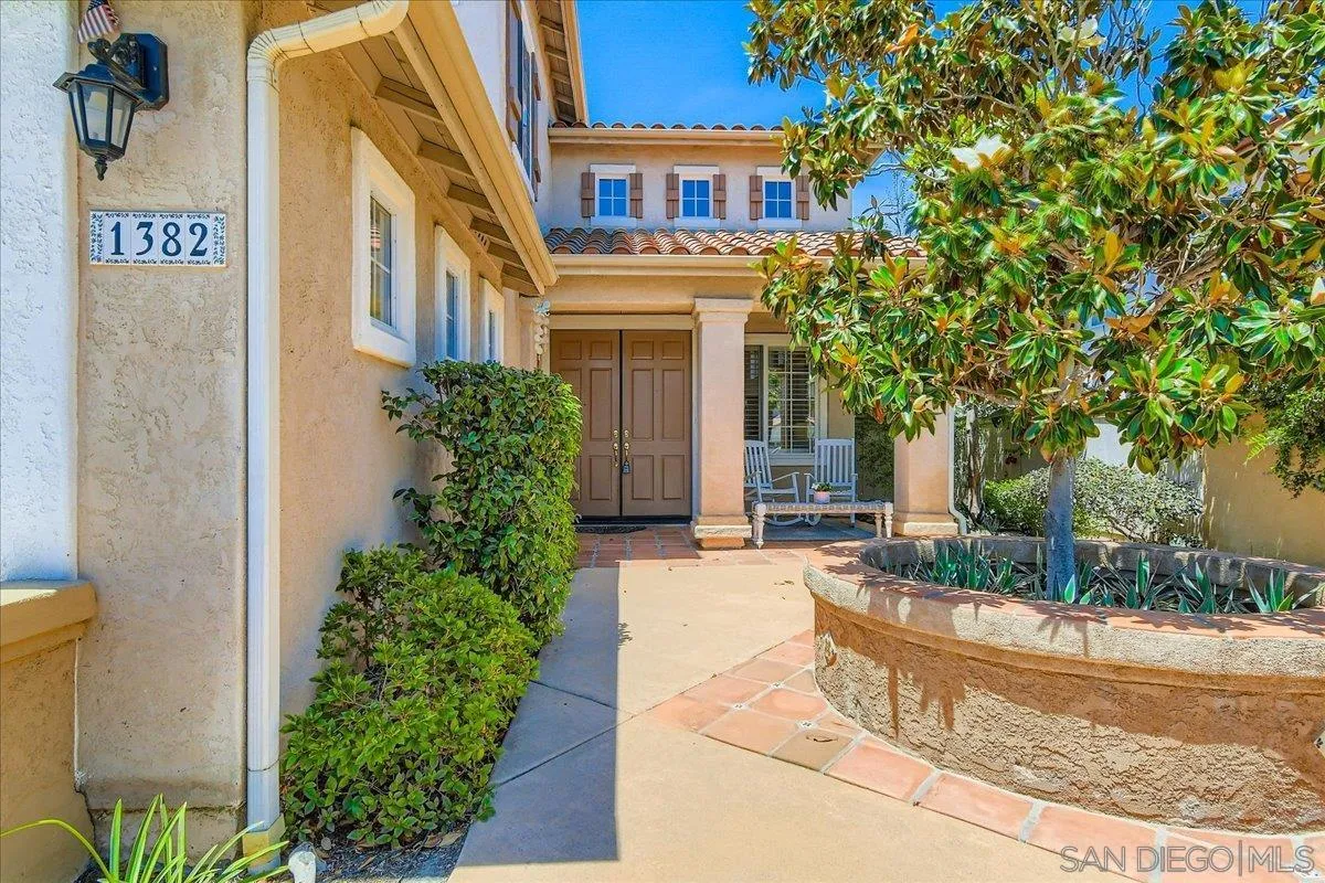 1382 Sparrow Road Carlsbad, CA 92011 - Photo 3 of 34 a front view of a house with garden