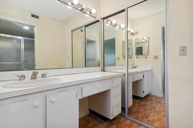 15074 Witney Road, Unit C101 Delray Beach, FL 33484 - Photo 14 of 25 10_15074WitneyRd_Unit101_13_PrimaryBathr