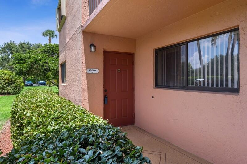 15074 Witney Road, Unit C101 Delray Beach, FL 33484 - Photo 2 of 25 02_15074WitneyRd_Unit101_301_Entrance_Fl