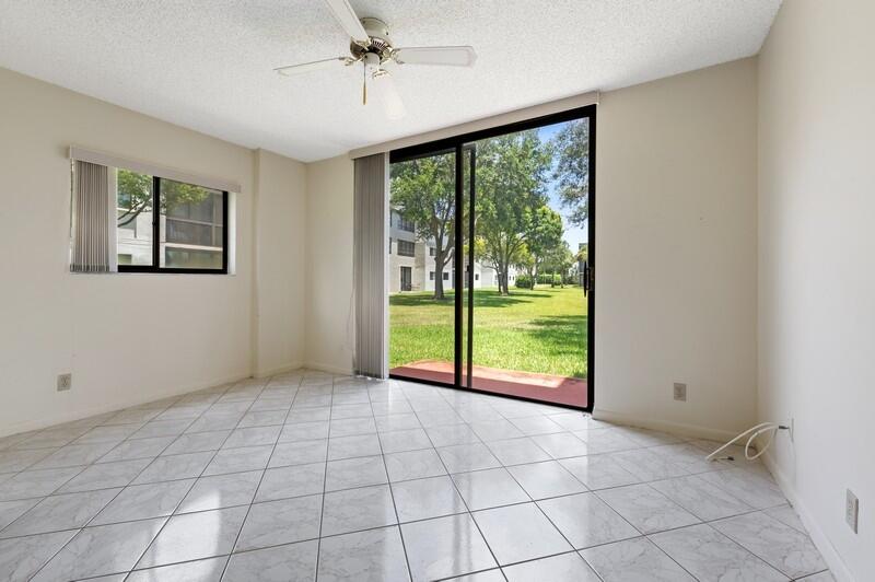 15074 Witney Road, Unit C101 Delray Beach, FL 33484 - Photo 5 of 25 09_15074WitneyRd_Unit101_97_SunRoom_Flex