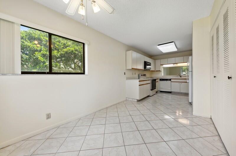 15074 Witney Road, Unit C101 Delray Beach, FL 33484 - Photo 9 of 25 07_15074WitneyRd_Unit101_191_KitchenBrea