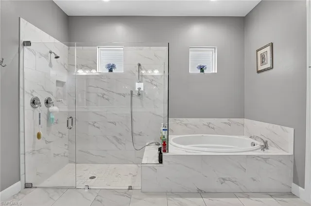 a bathroom with a sink vanity and a mirror