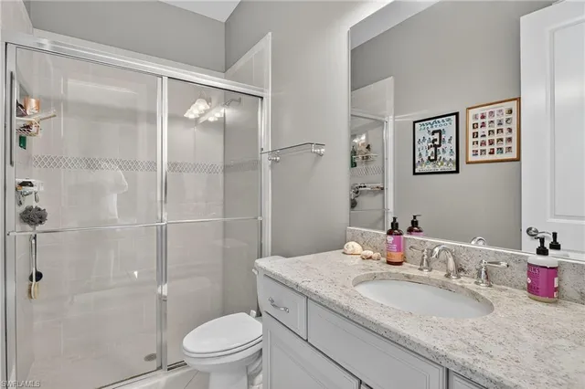 a bedroom with two beds and a large window