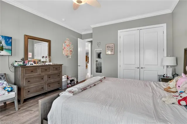 a bathroom with a granite countertop sink toilet mirror and shower